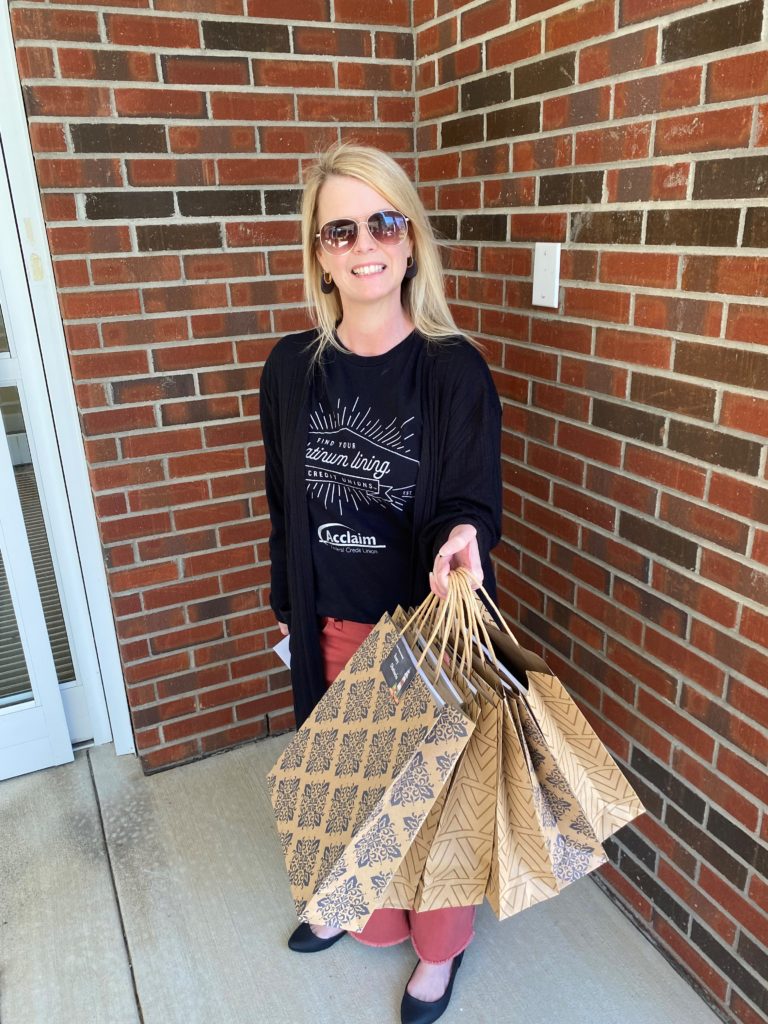 christie holding gift bags