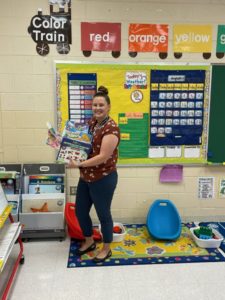 Teacher holding items bought from her Amazon list