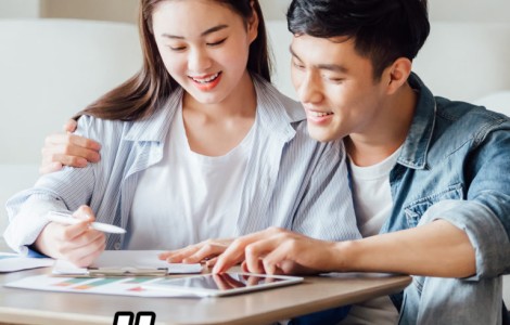 couple sitting at table making financial plan