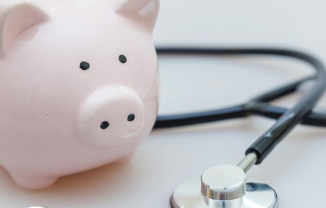 piggy bank and stethoscope