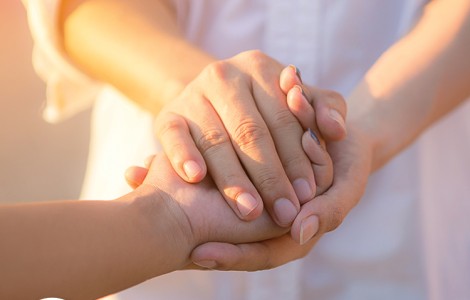 two people holding hands