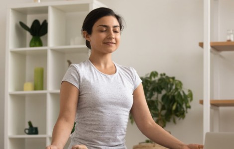 Woman sitting in meditative pose