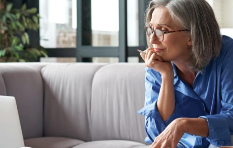 woman thinking deeply in front of a planner